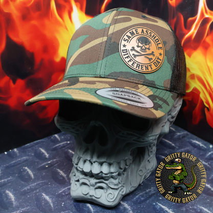 Same Asshole Different Day Patch Hat Yupoong 6606 Classic Trucker Cap in Green Camo/Black from Gritty Gator