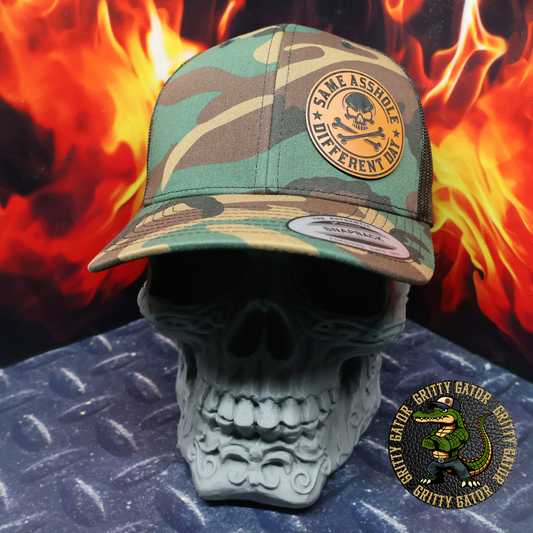 Same Asshole Different Day Patch Hat Yupoong 6606 Classic Trucker Cap in Green Camo/Black from Gritty Gator